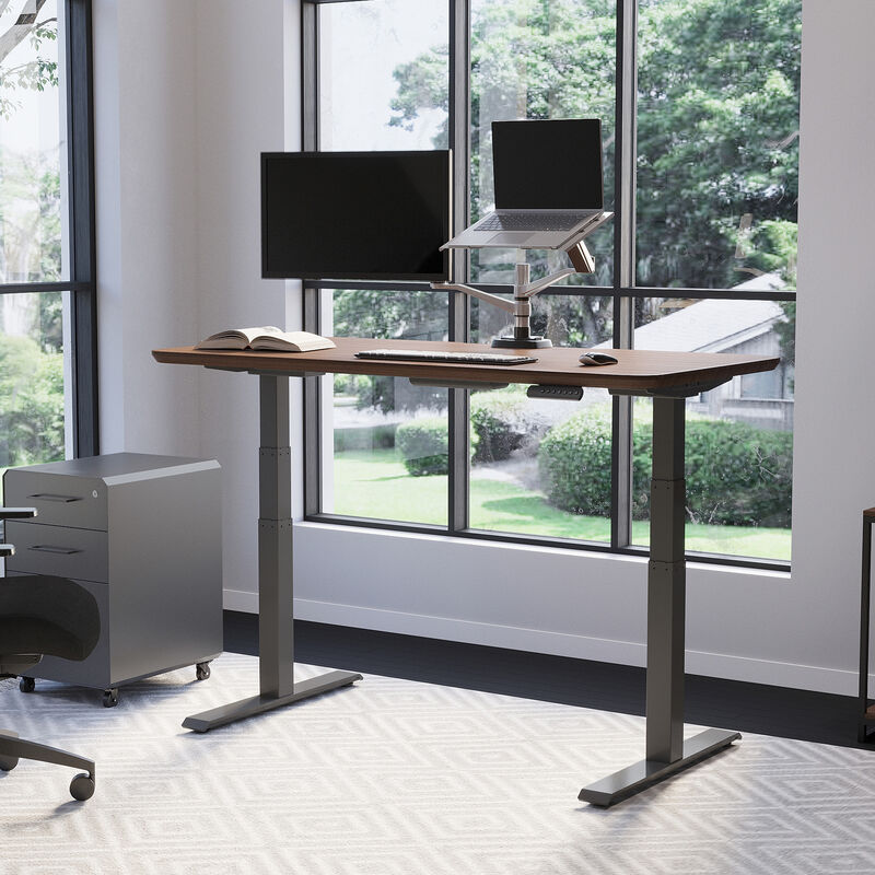 Electric Standing Desk 60x30 Walnut in raised position at home image number null